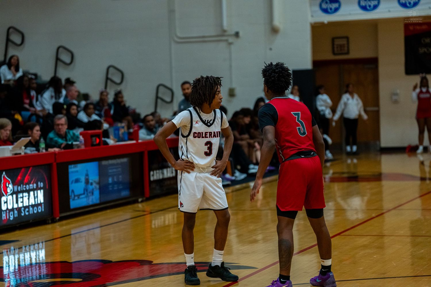 Colerain #3 faces off against opponent #3 during a high school basketball game.
