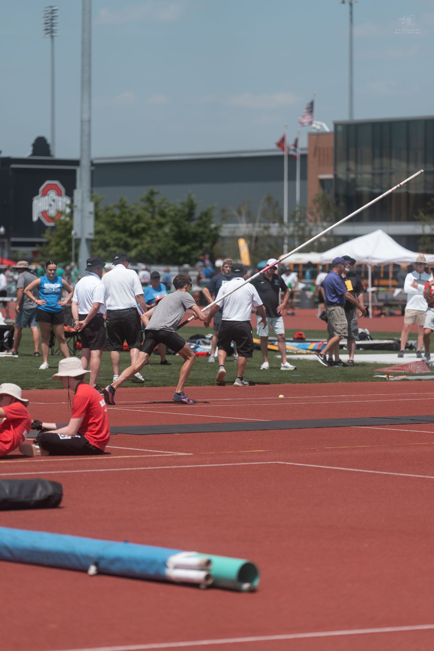 Athlete prepares to throw a javelin at an outdoor track and field competition at Ohio State University.