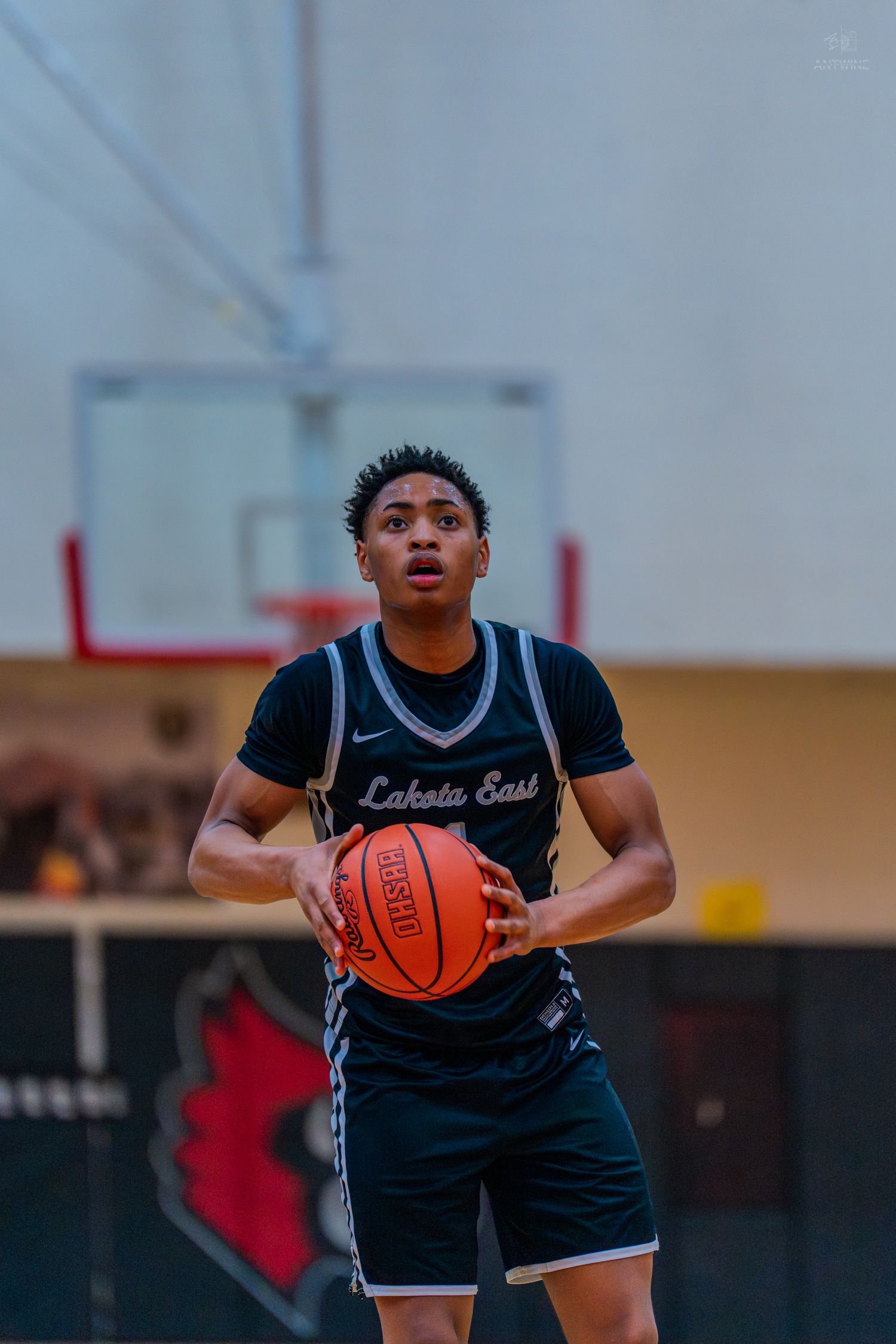 Lakota East basketball player prepares for a free throw shot during a high school game.