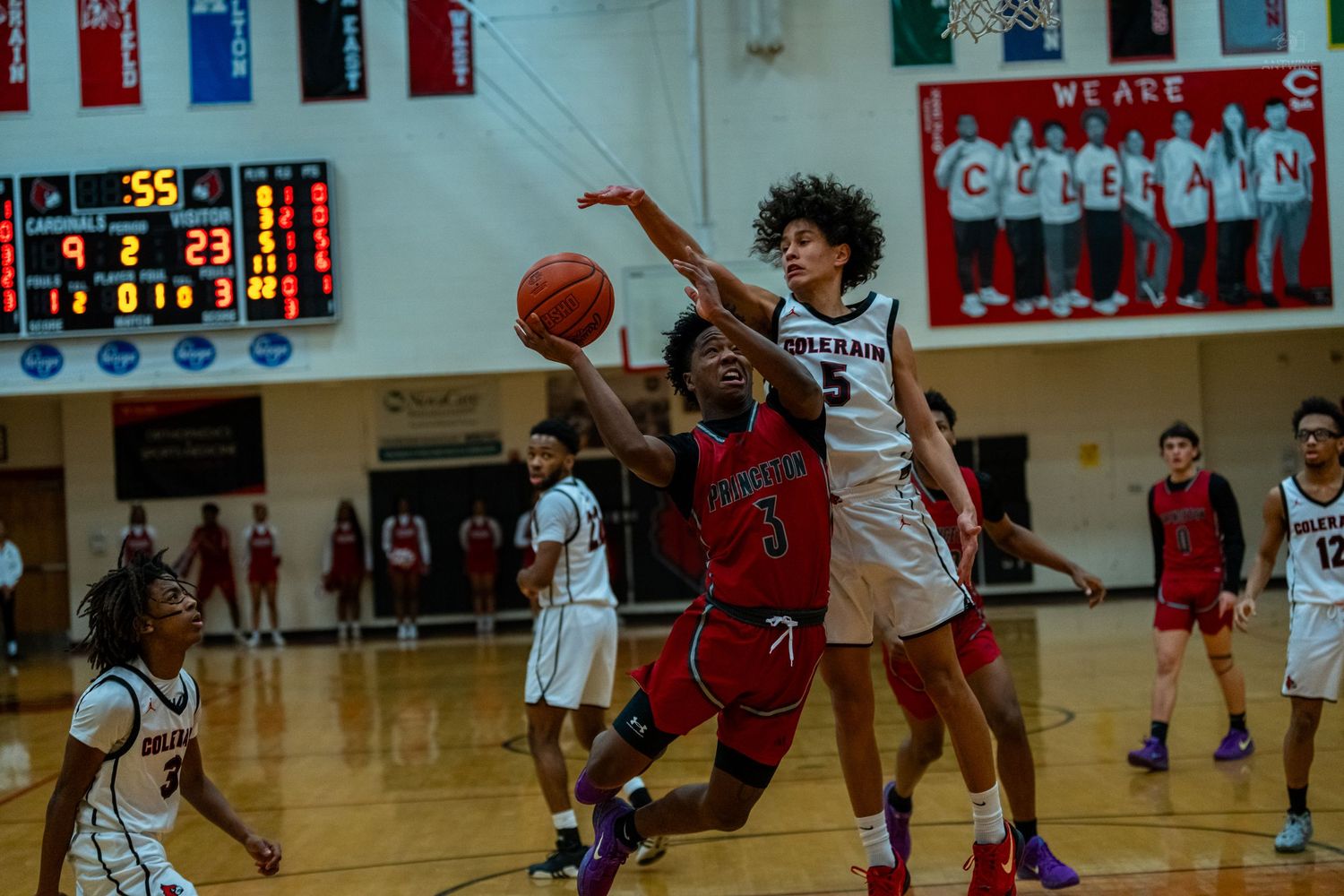 Colerain #5 blocks shot attempt during exciting high school basketball game on home court.