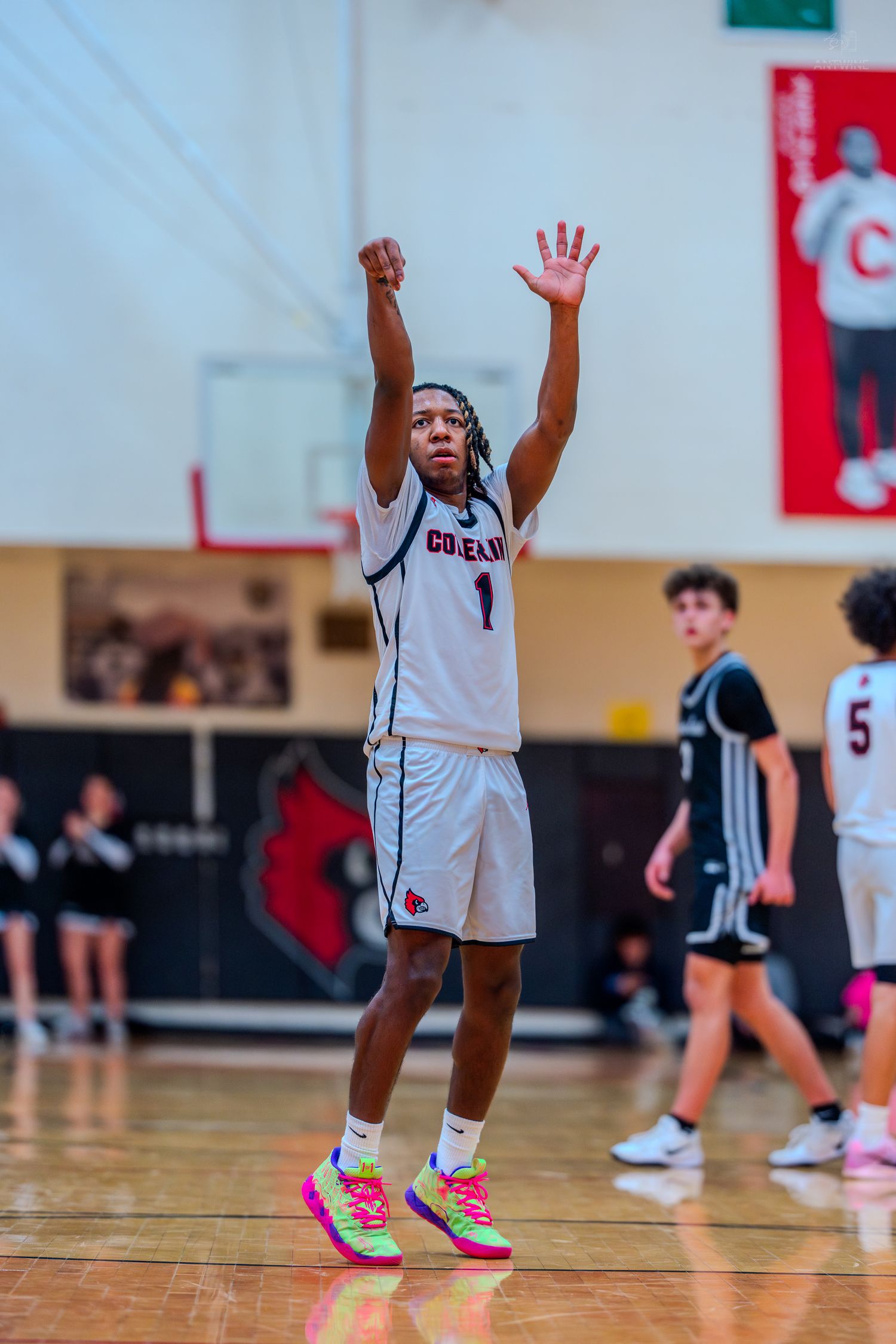 Colerain High School basketball player #1 releases jump shot with perfect follow-through during varsity basketball game.