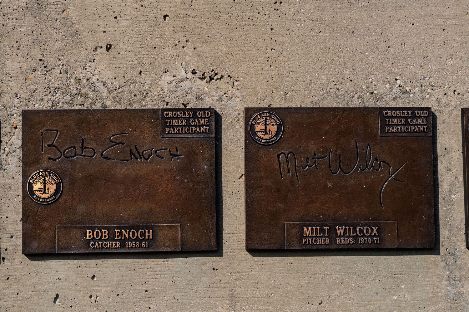 Bronze plaques honoring Bob Enoch, catcher 1954-61, and Milt Wilcox, pitcher, with autographs at Crosley Old-Timer Game.