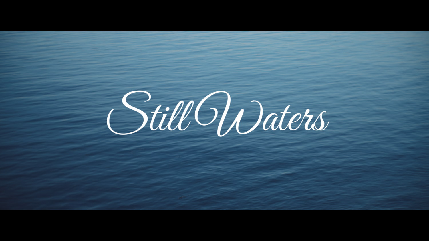 Still Waters title card displayed over calm blue ocean water in a cinematic film opening scene.