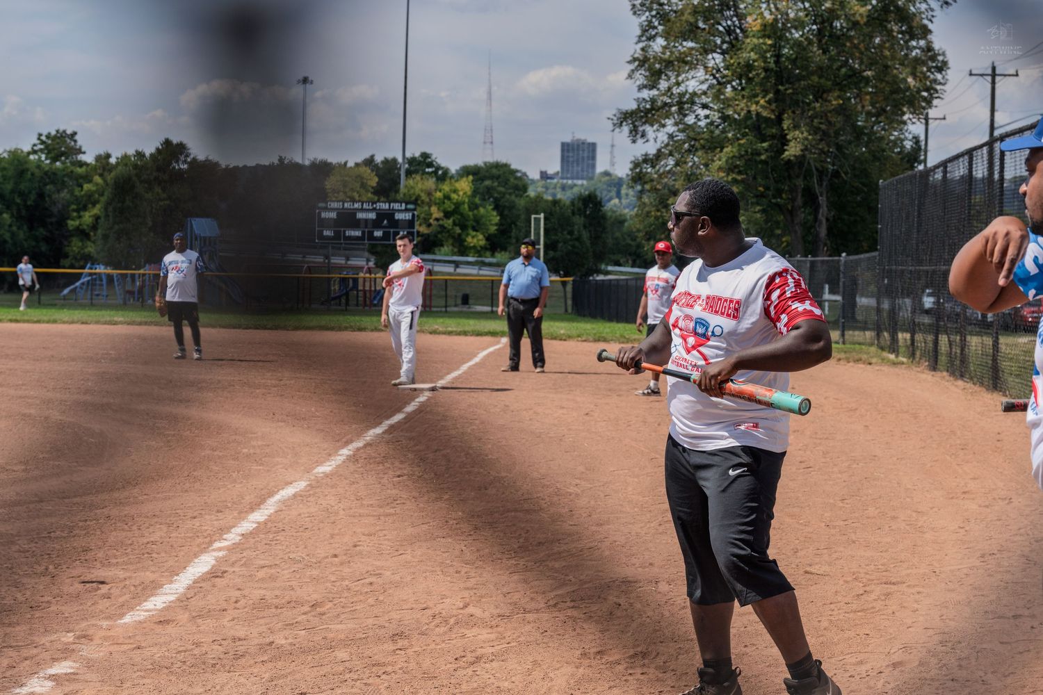 Batter preparing to swing at a charity softball game at Chris Nelms All-Star field.
