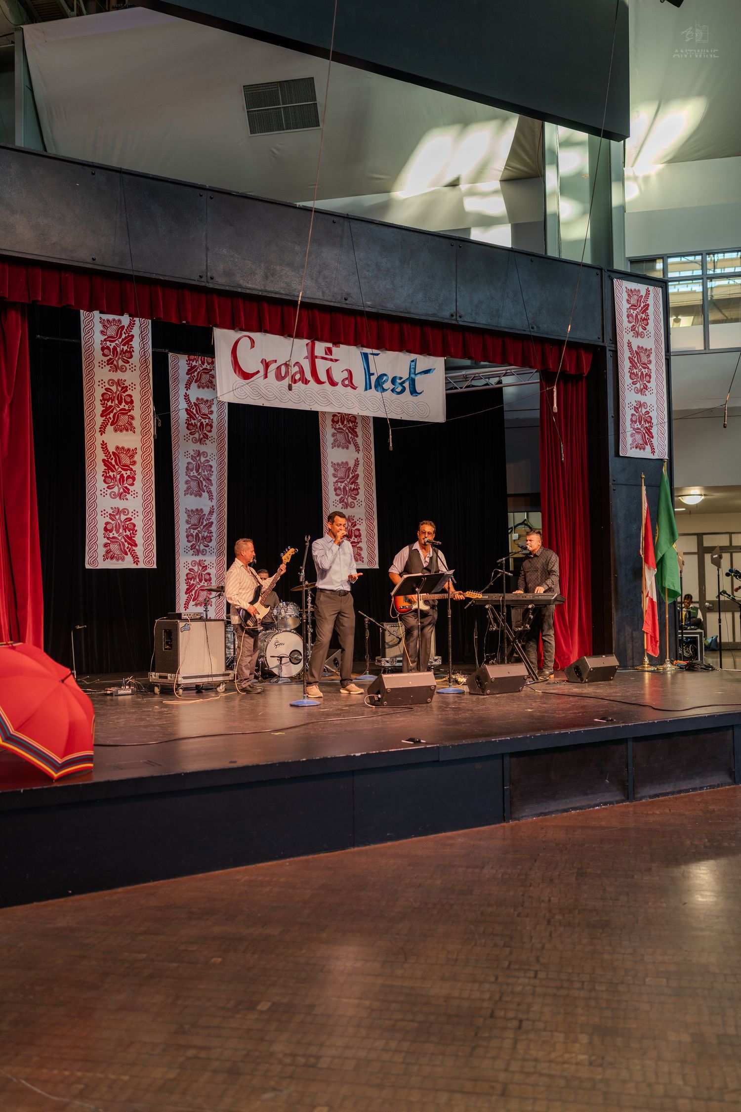 Musicians performing live on decorated stage at Croatia Fest cultural festival event.