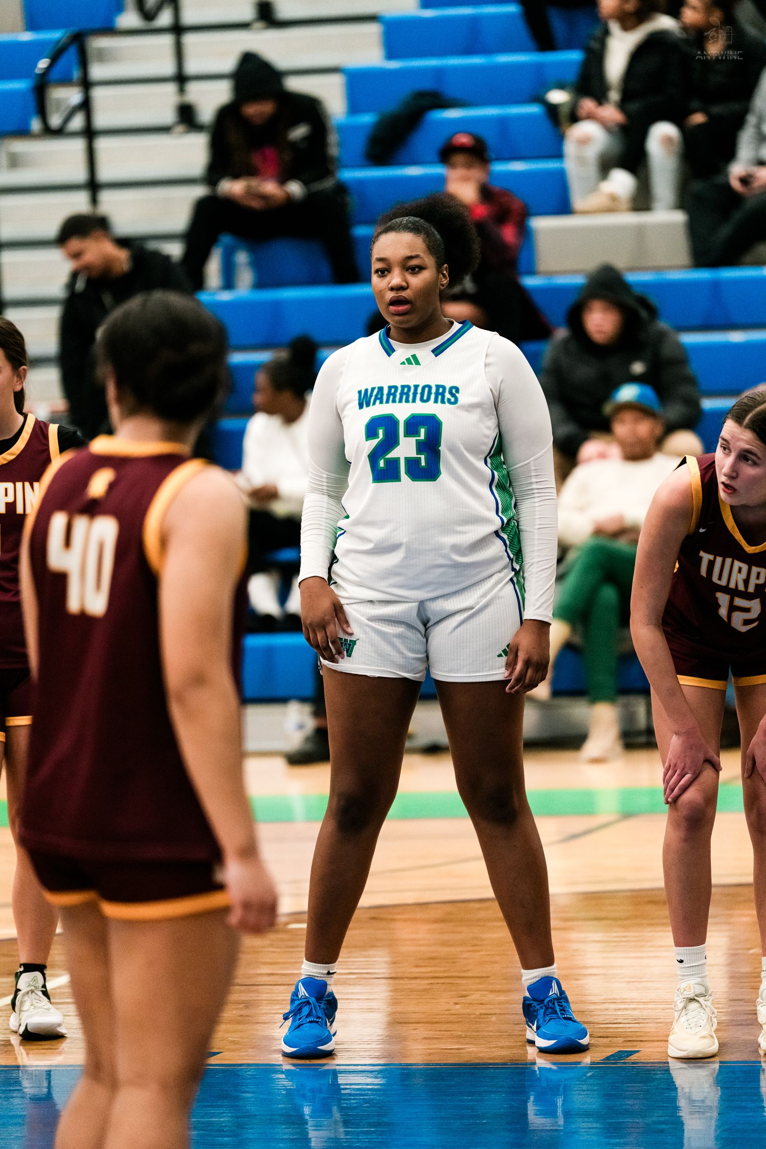 Warriors #23 stands ready during a girls high school basketball game against Turpin.