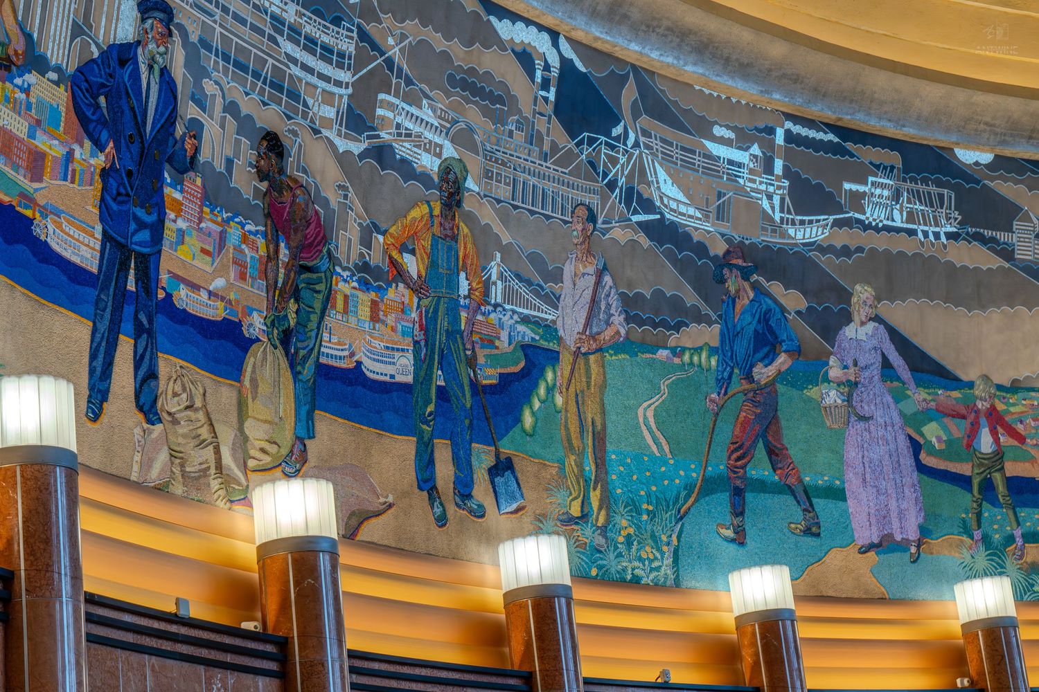 Colorful mosaic mural depicting historical figures in a grand building interior with decorative lighting.