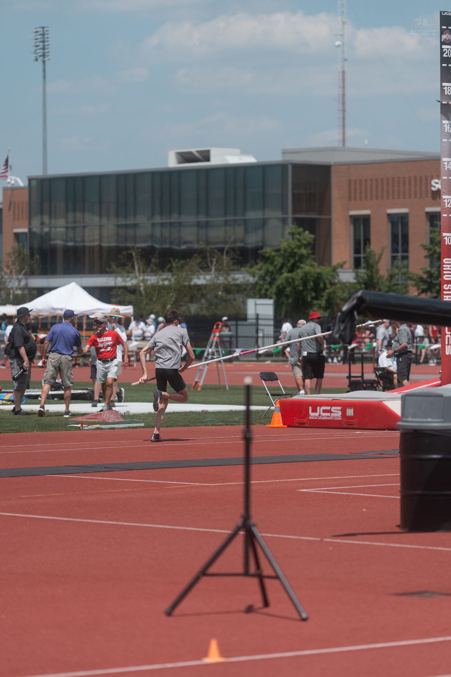 Pole vaulter runs down the track during a collegiate track and field meet at Ohio State University.