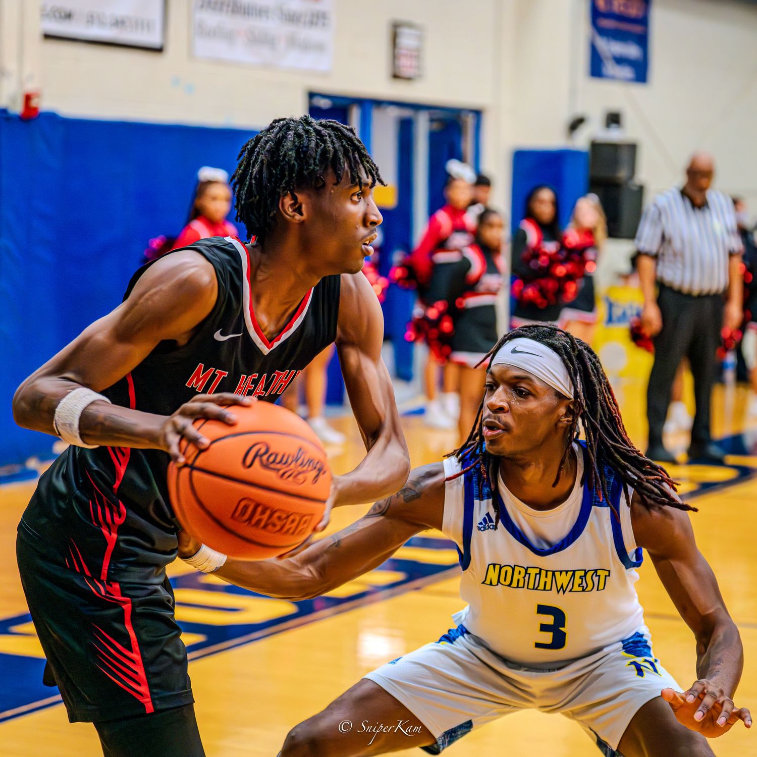 High school basketball players compete in fast-paced game between Miami and Northwest teams.