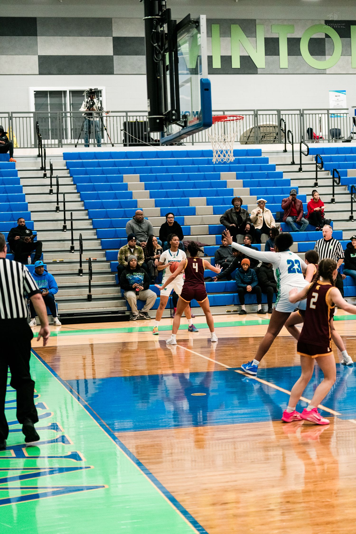 Players compete near the basket during a girls high school basketball game between Winton Woods and Turpin.