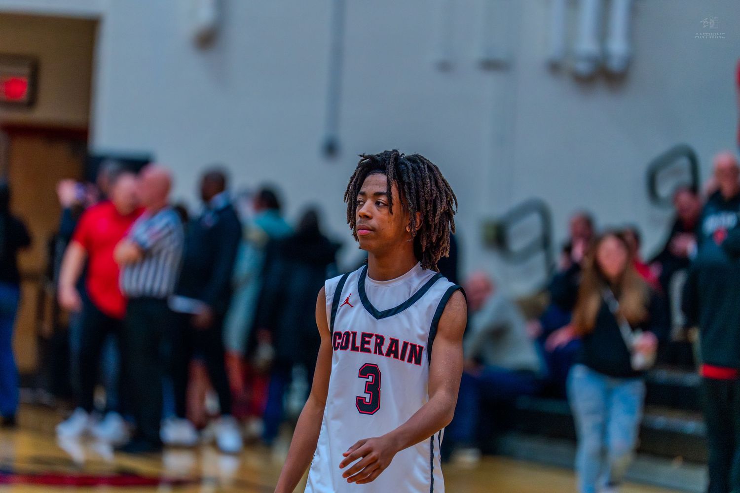 Colerain basketball player number 3 walks on the court during a high school game.