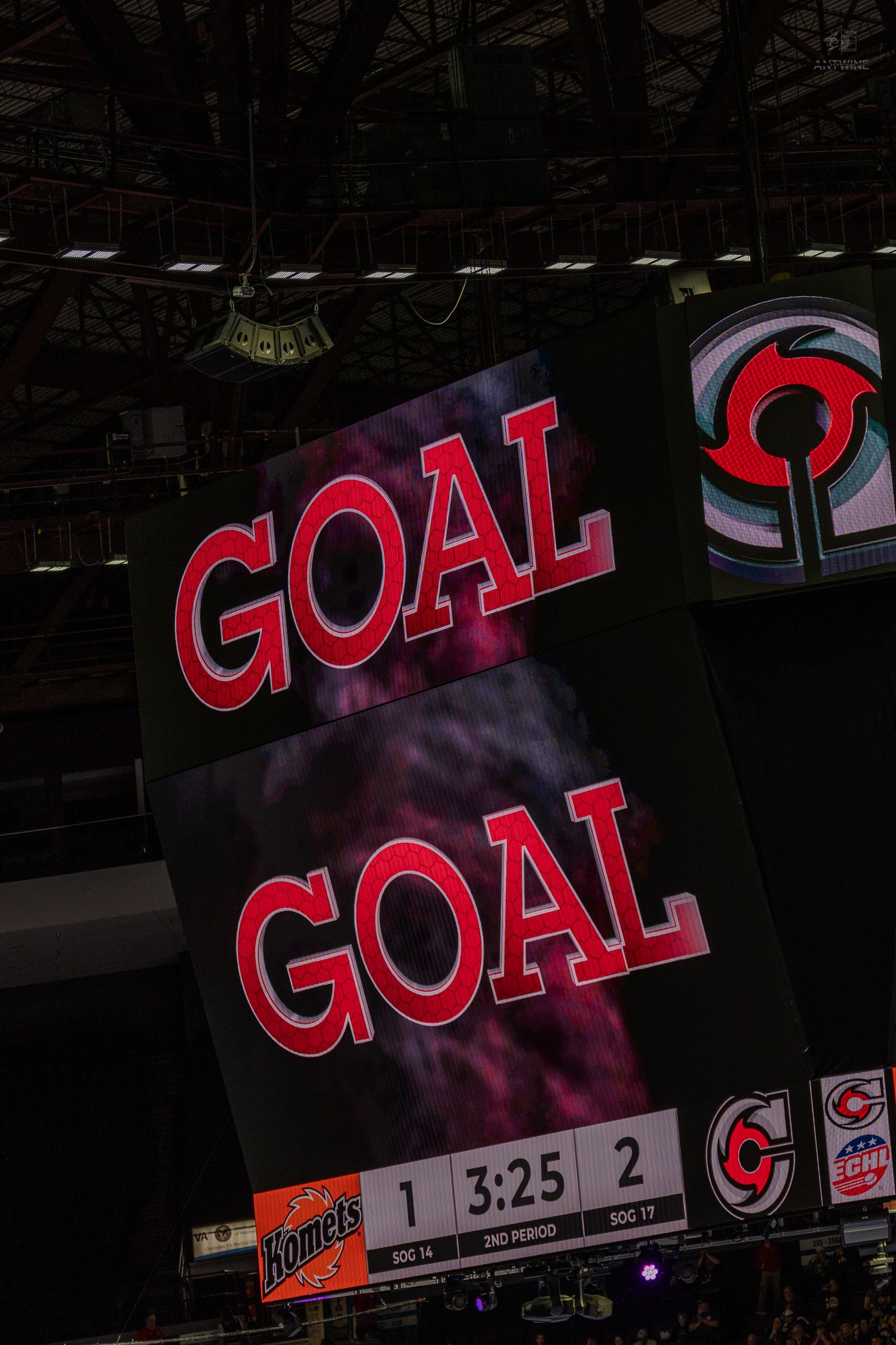 Arena scoreboard displays GOAL twice with Hornets vs opponent score 1-2 in the 2nd period at 3:25.