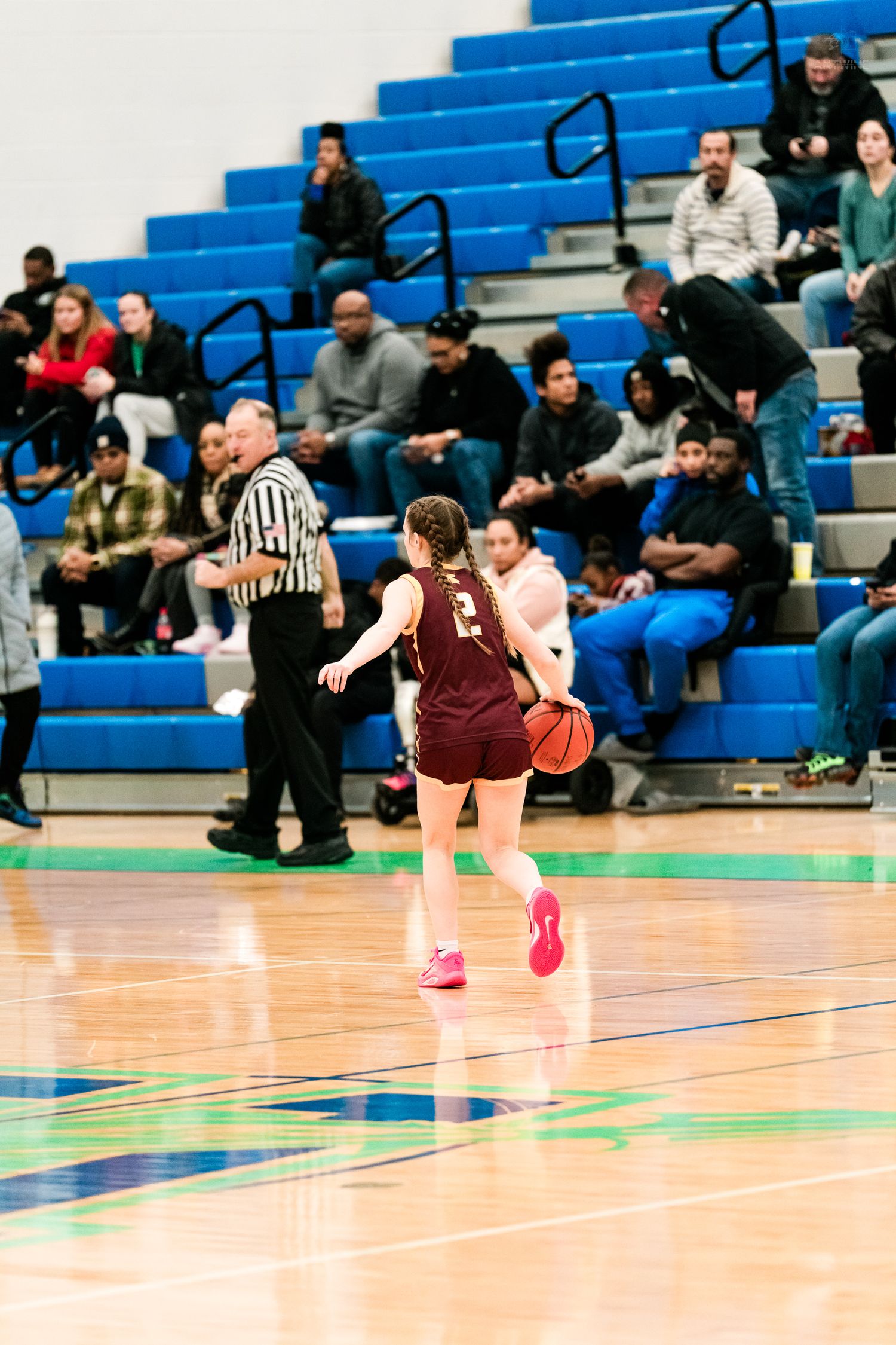 Turpin #2 dribbles upcourt during a girls high school basketball game.