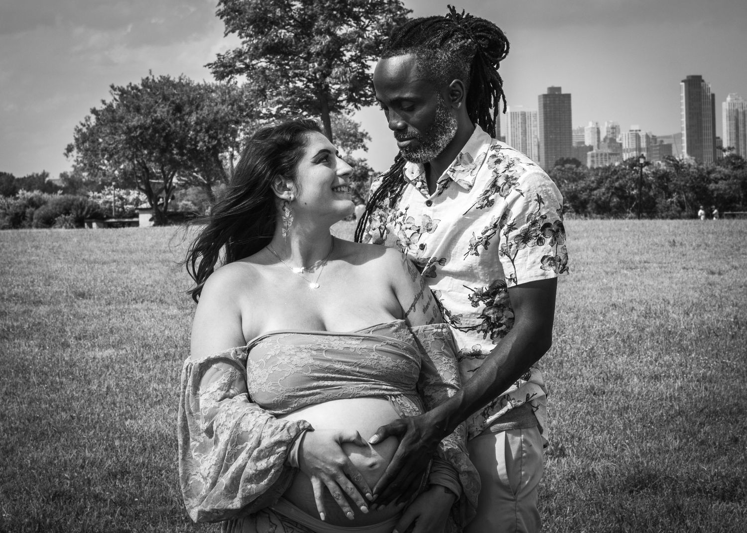 A black and white photo of a couple maturnity shoot.