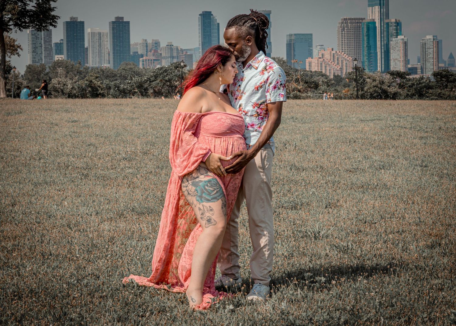 A couple posing during a maturnity shoot.