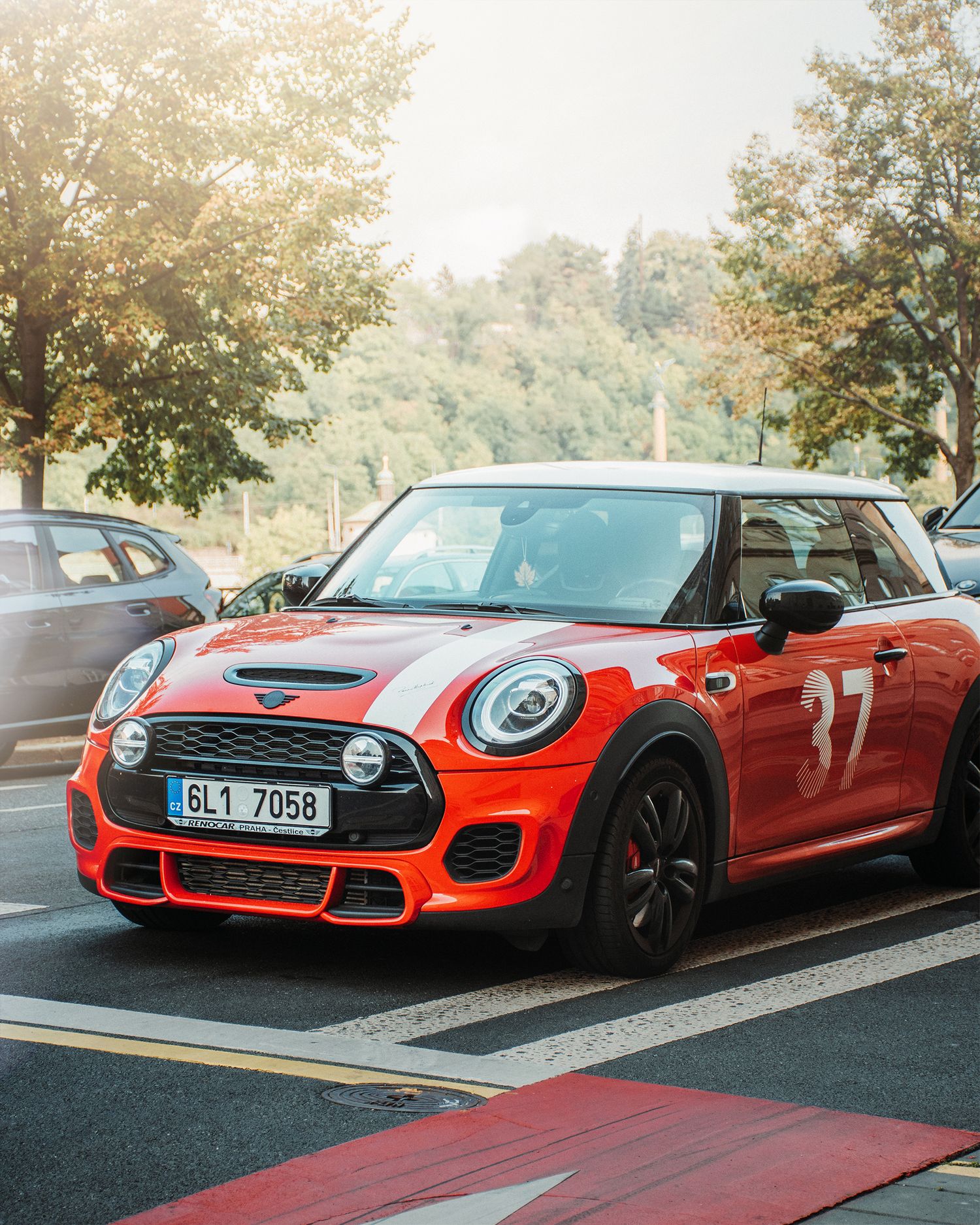 Red Mini Cooper JCW number 37 with Czech license plate BL1 7058 parked on a sunny street.