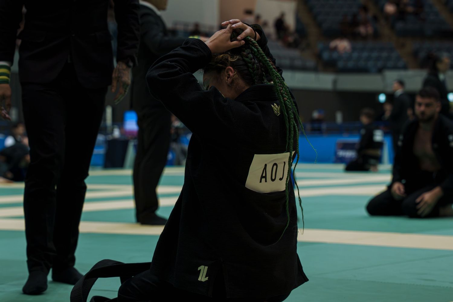 Professional combat sports photography capturing athletes competing in martial arts event with dynamic action and authentic emotion.