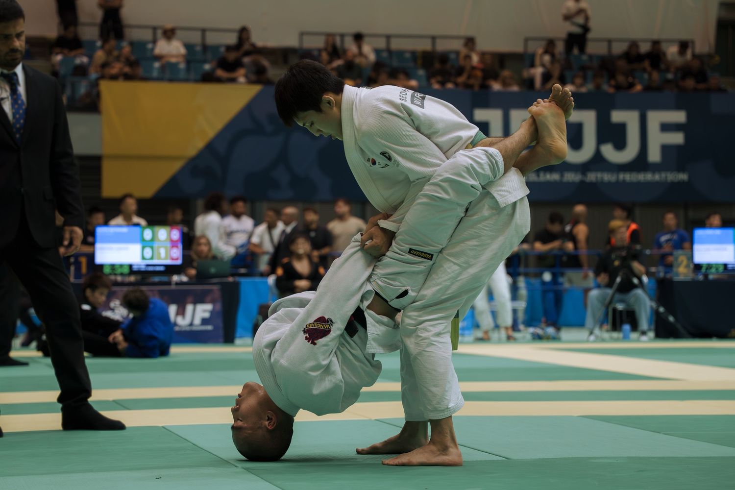 Professional combat sports photography capturing athletes competing in martial arts event with dynamic action and authentic emotion.