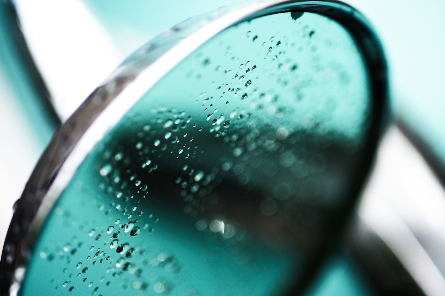 Rainy rear view mirror of an oldtimer car