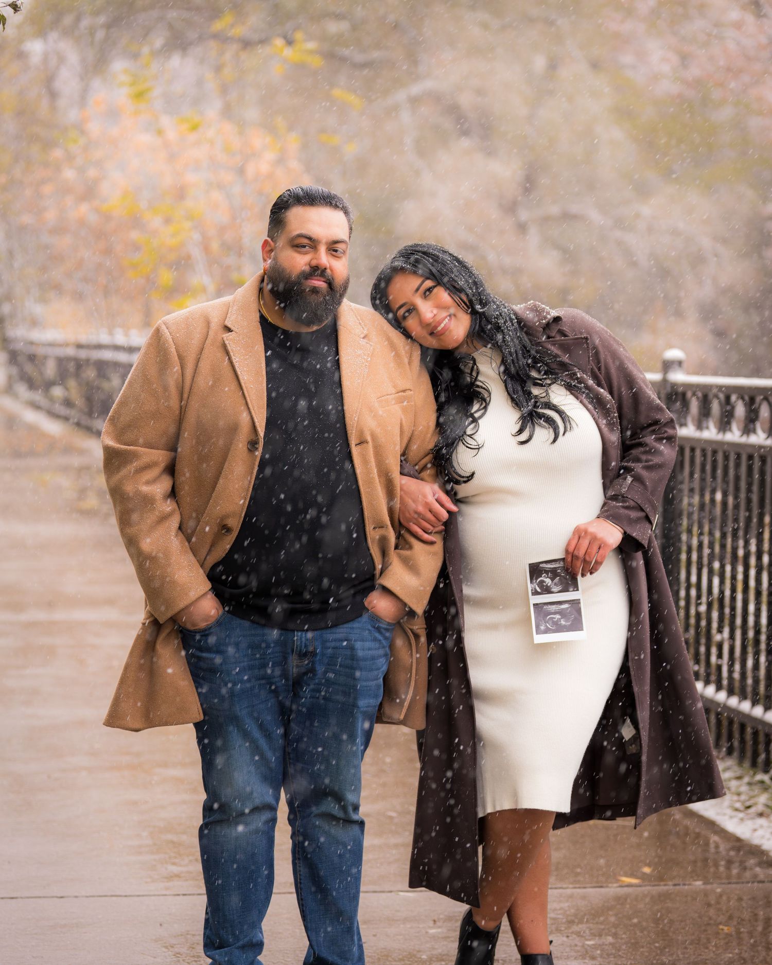 A romantic winter scene with a couple in warm clothing.