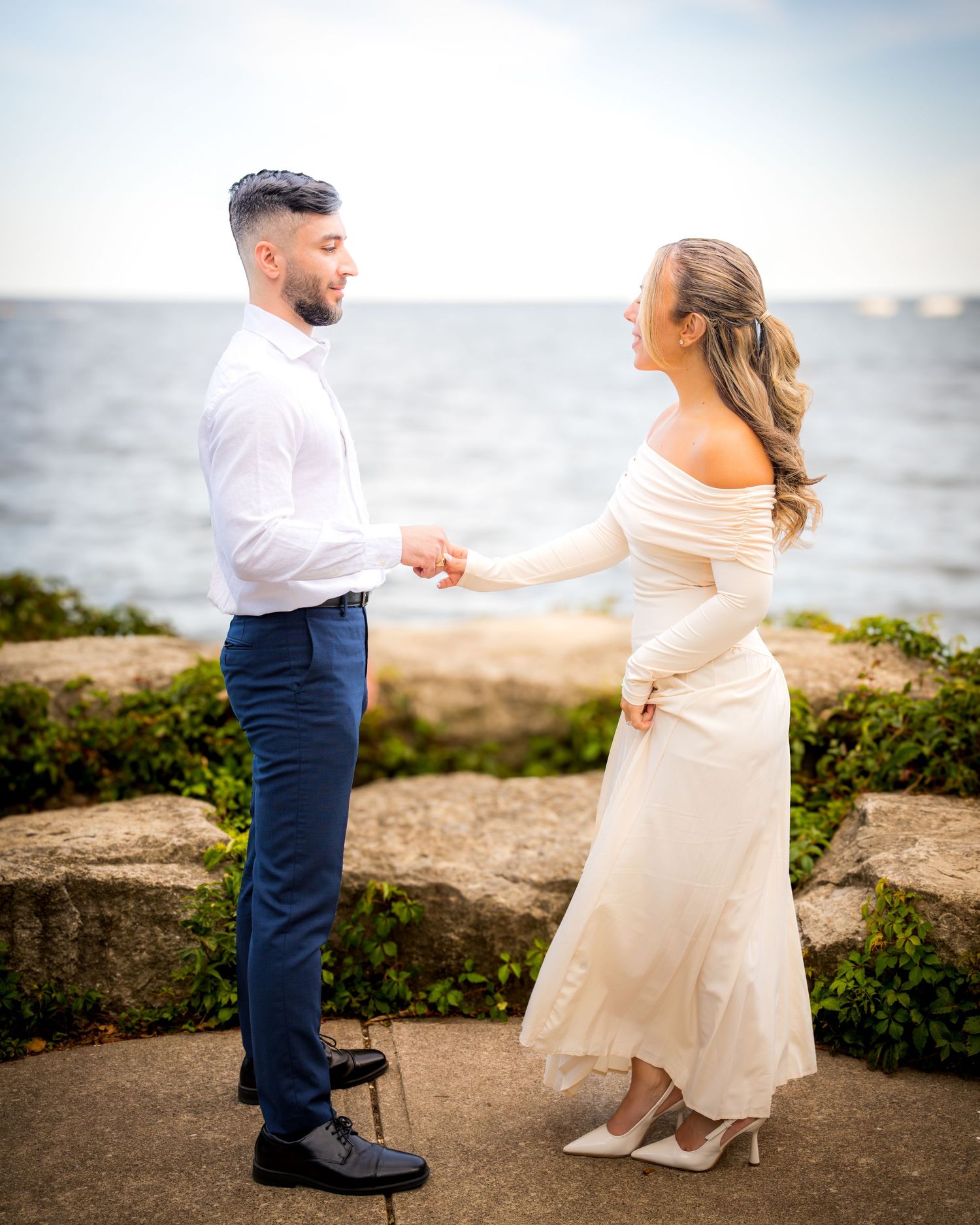 A romantic dance sequence photographed against a coastal backdrop.