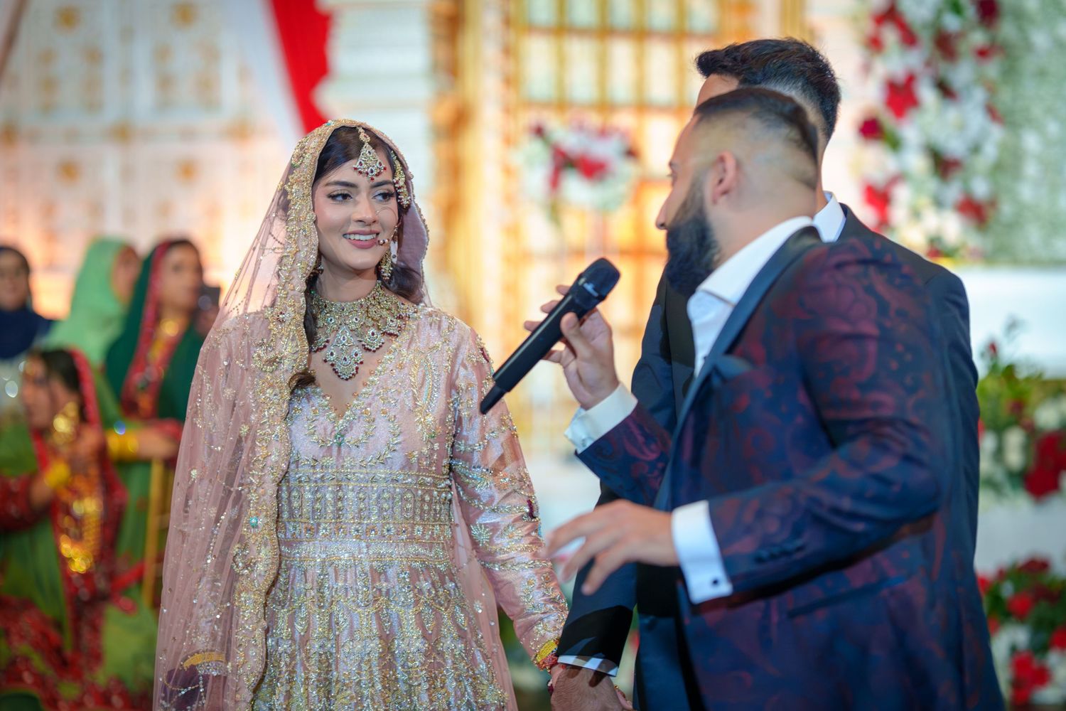 Wedding celebration candid moments captured with couple and guests in traditional attire.