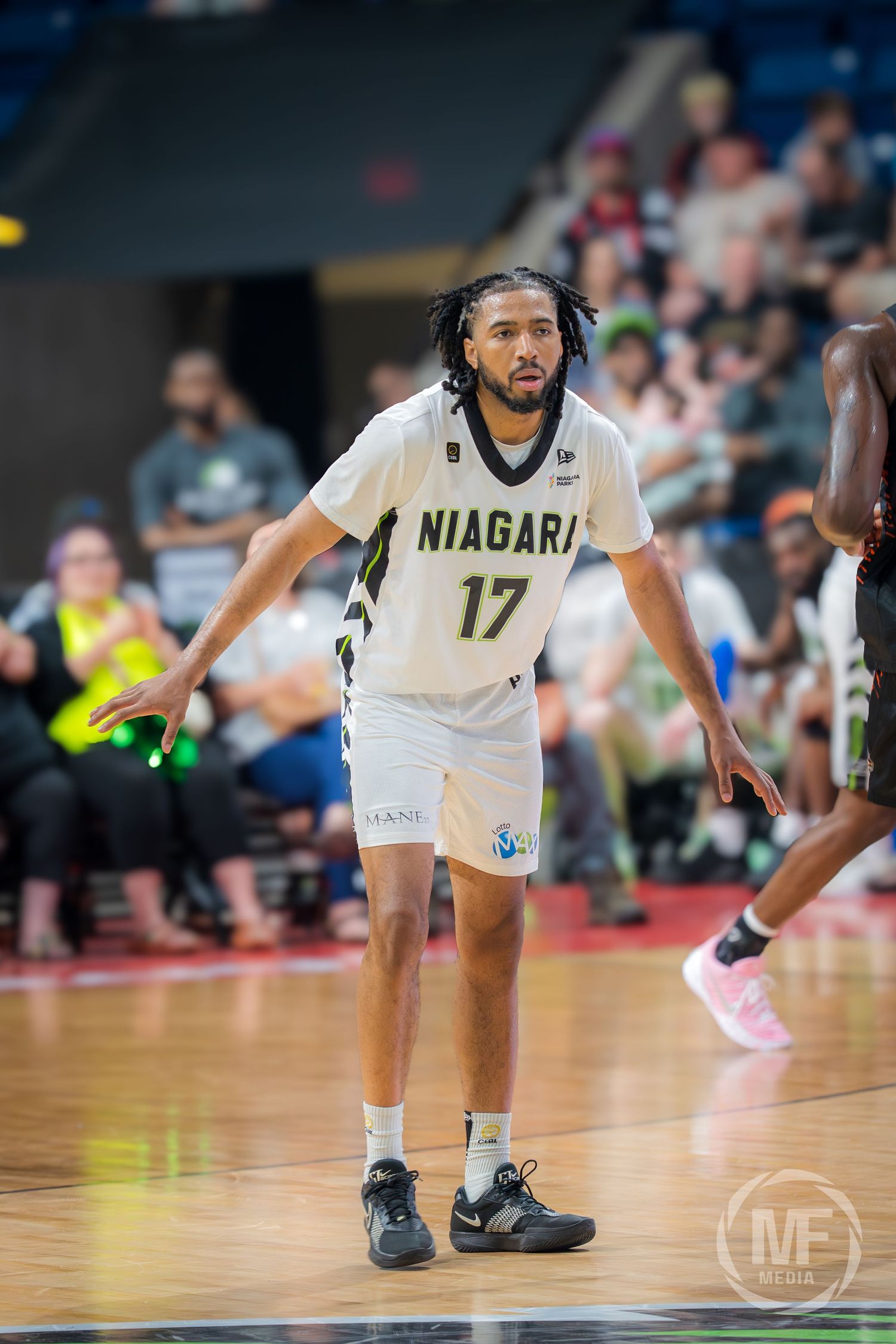 Niagara River Lions player #17 gestures on the court during a professional CEBL basketball game.