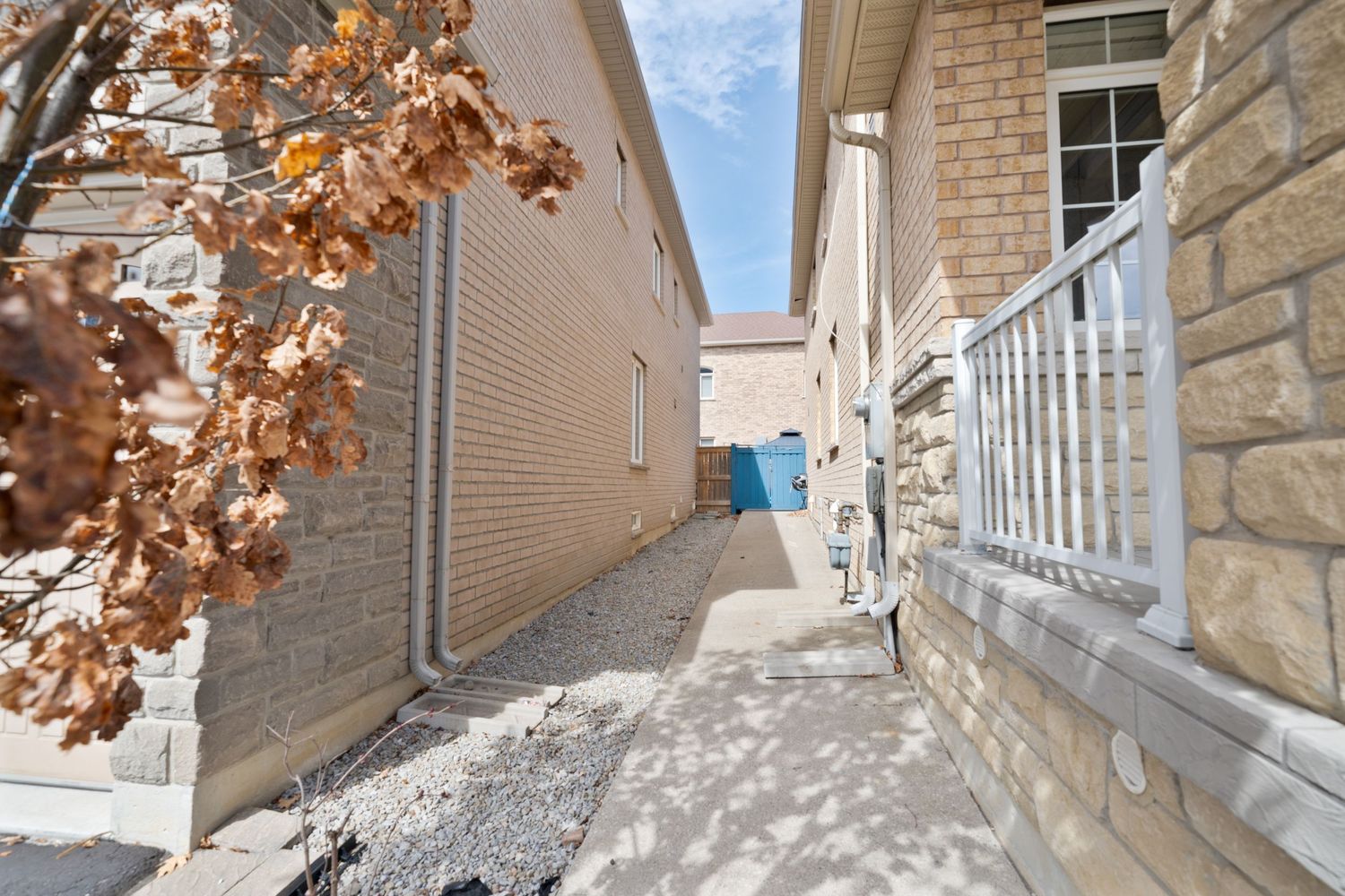 A series of architectural details showing stone walls, brick facades, and autumn leaves in an urban setting.