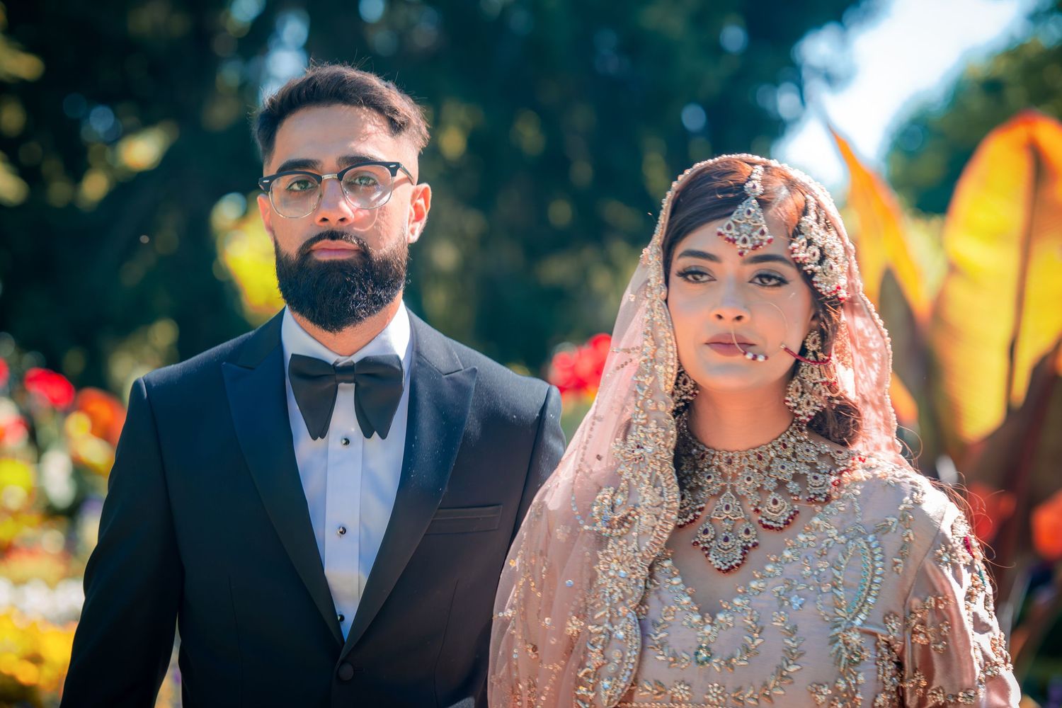 Wedding portrait series showing couple in traditional attire against colorful outdoor backdrop.