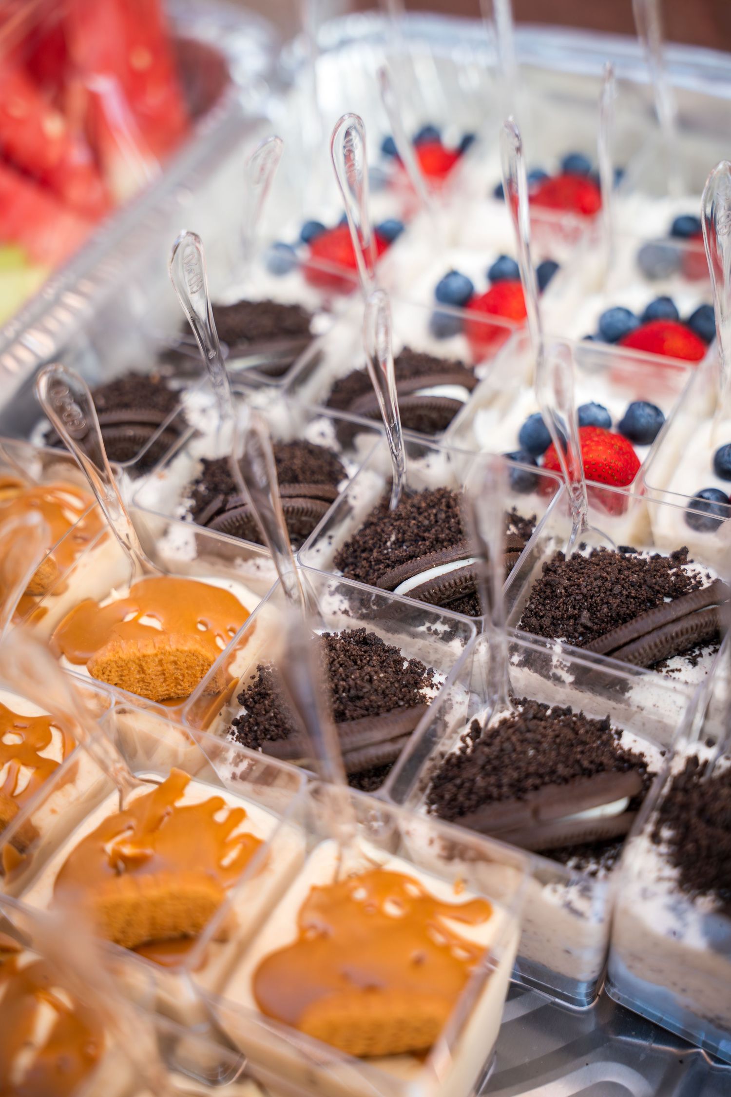 Close-up view of chocolate and caramel treats arranged in neat rows with clear packaging.