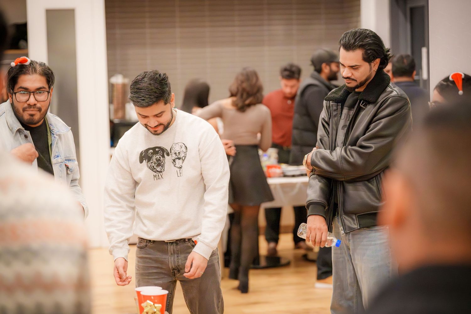 Group of people participating in an indoor activity with focused expressions.