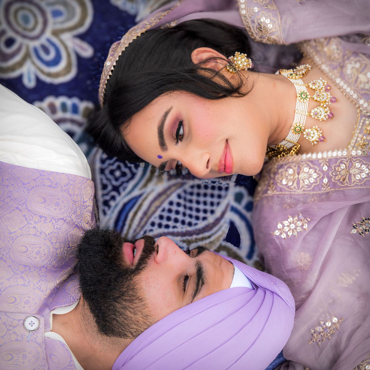 Close-up portrait shots showing details of purple and gold traditional Indian wedding attire.