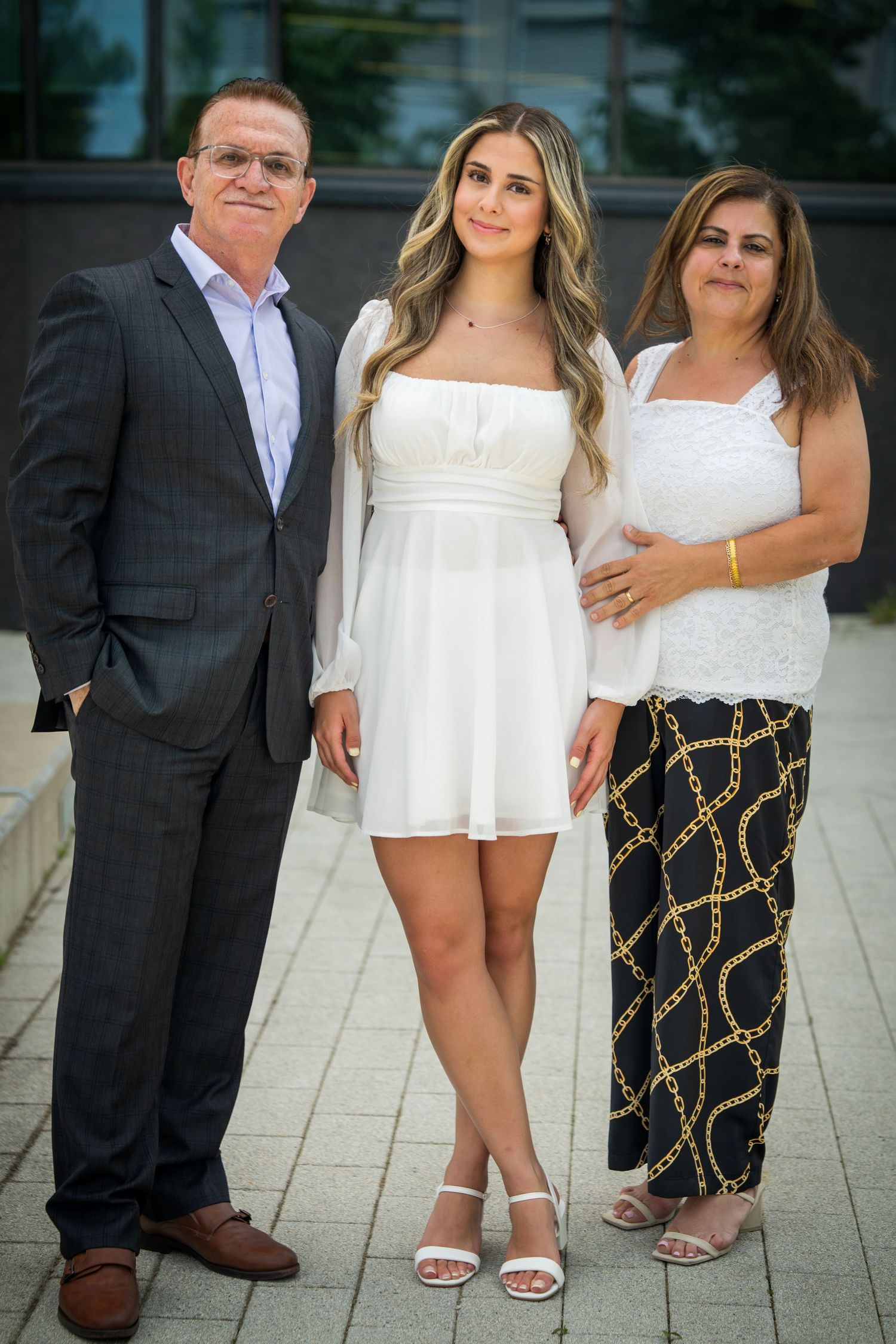 Group portrait showing contrast between formal and casual summer outfits.