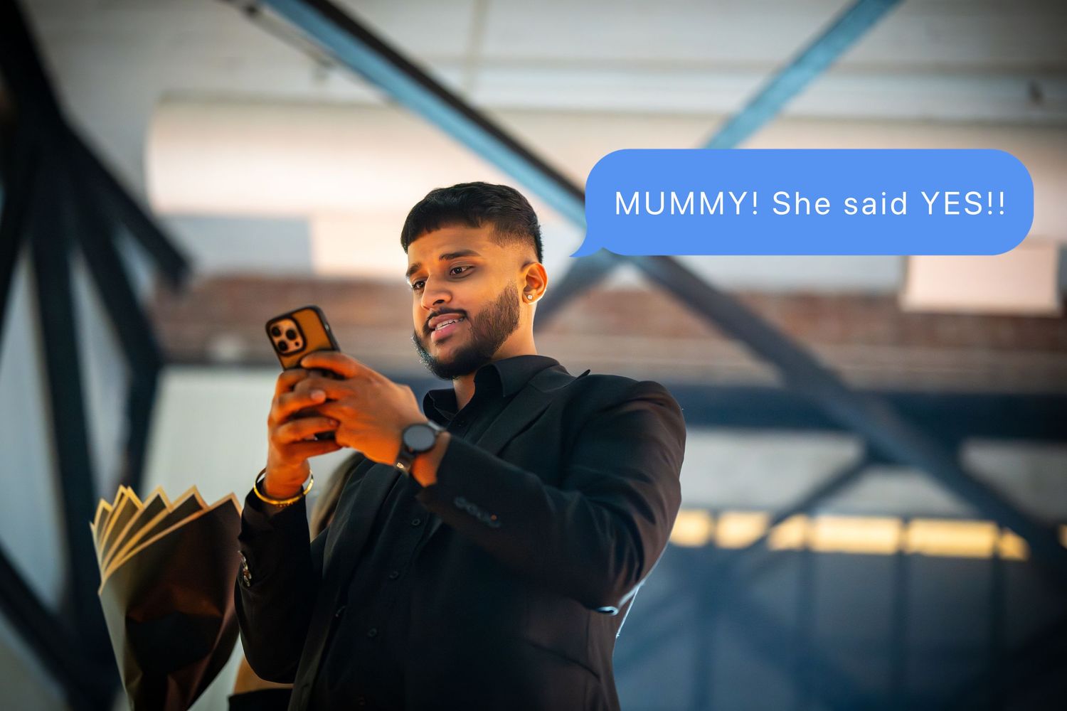 A person checking their phone during what appears to be a special event setup.