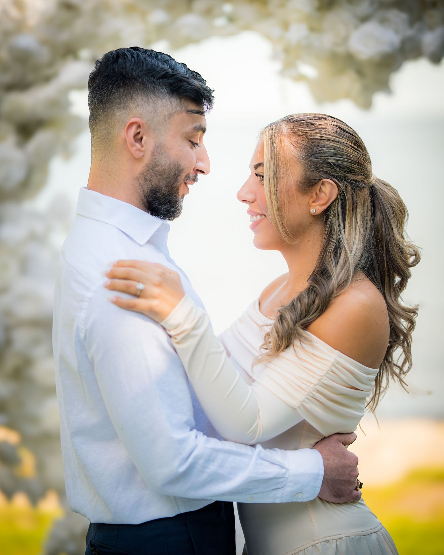 Romantic dance sequence of newlyweds under floral decorations.