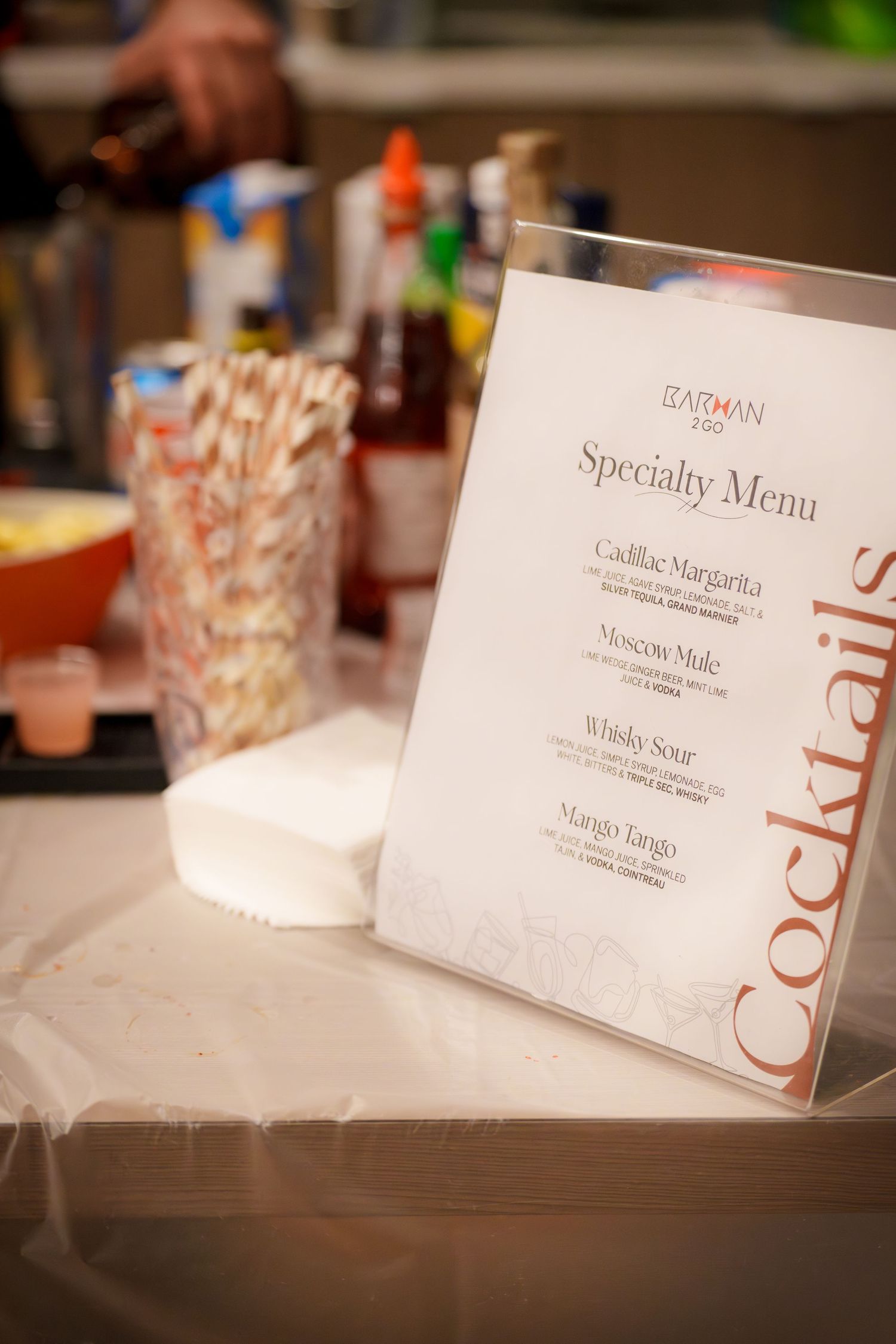 Close-up of elegant name cards or place settings arranged on a white surface.