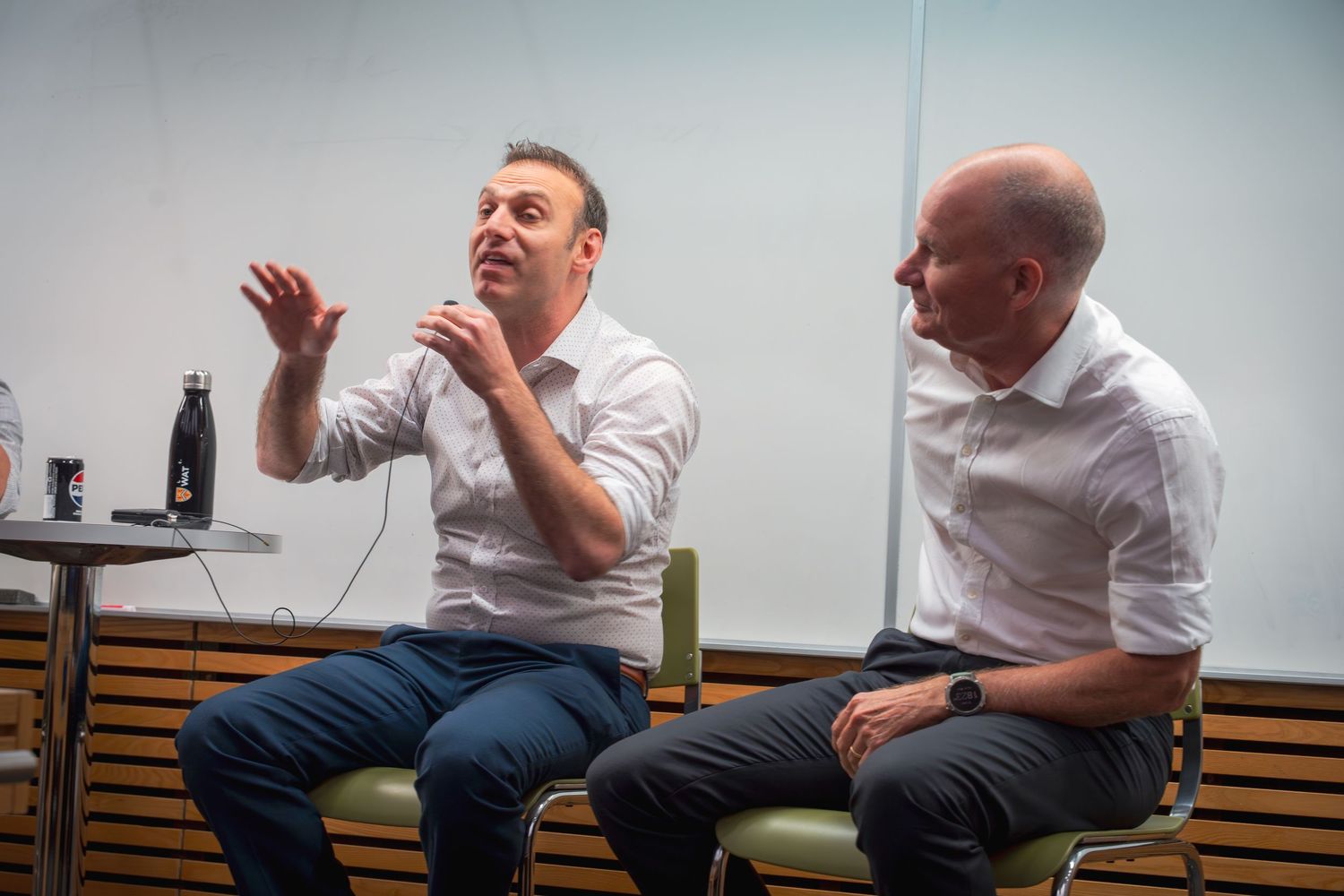 Audience members engaging in discussion during a conference session.