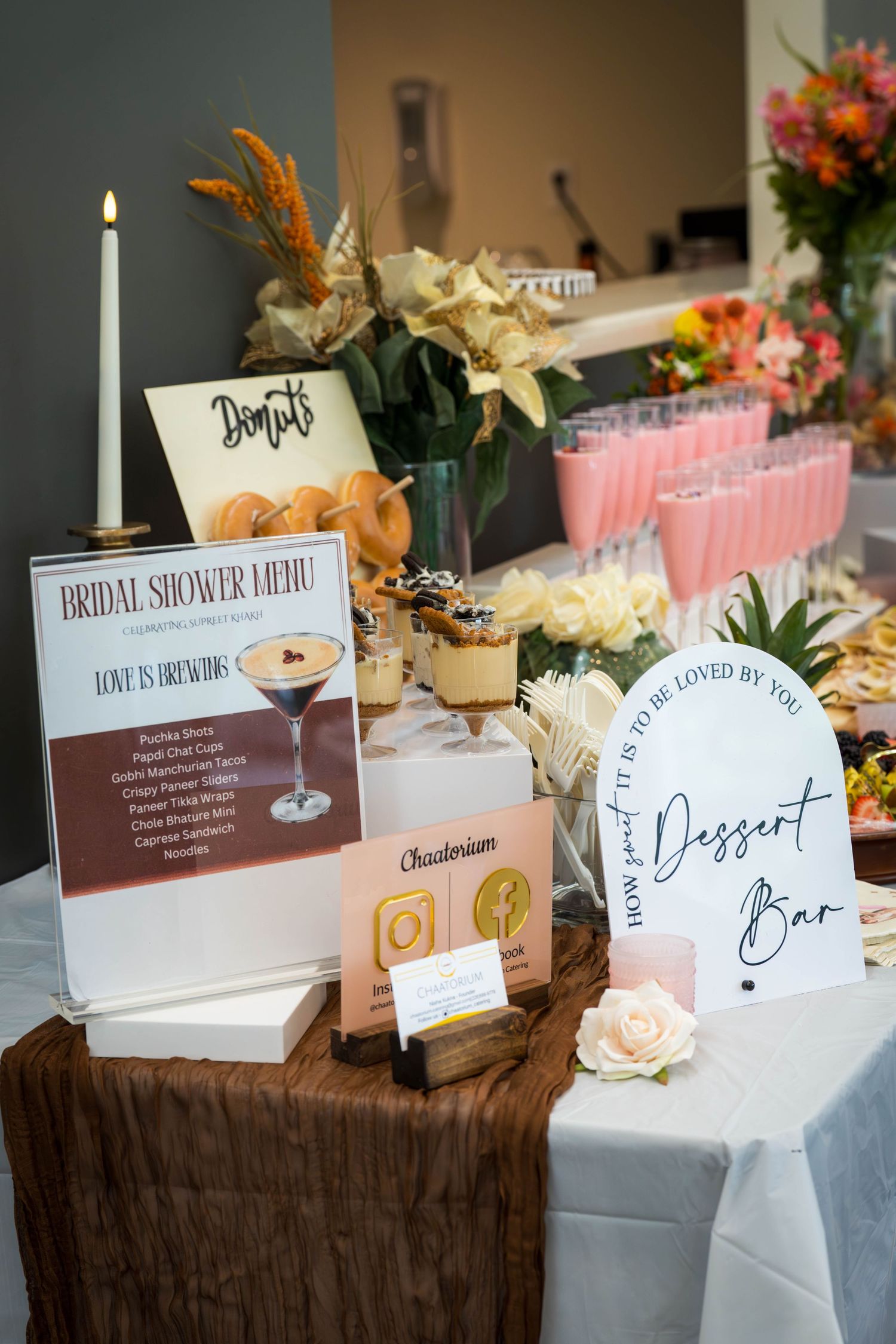 Elegant wedding reception table setup with place cards and floral decorations.