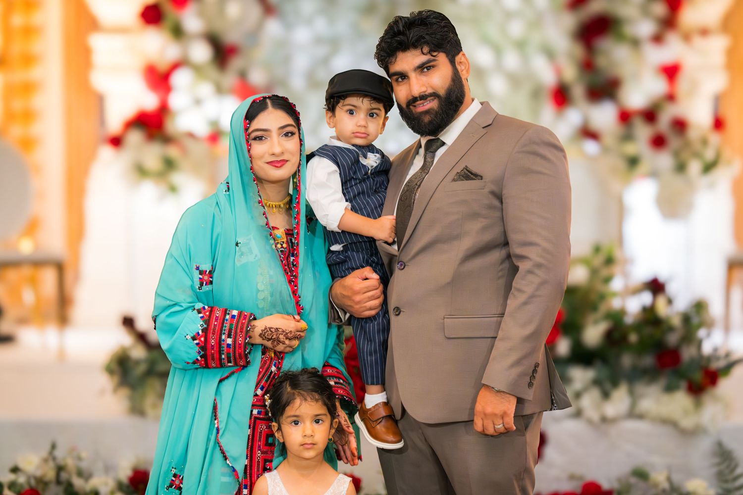 Family portrait session with traditional South Asian outfits and casual western wear.