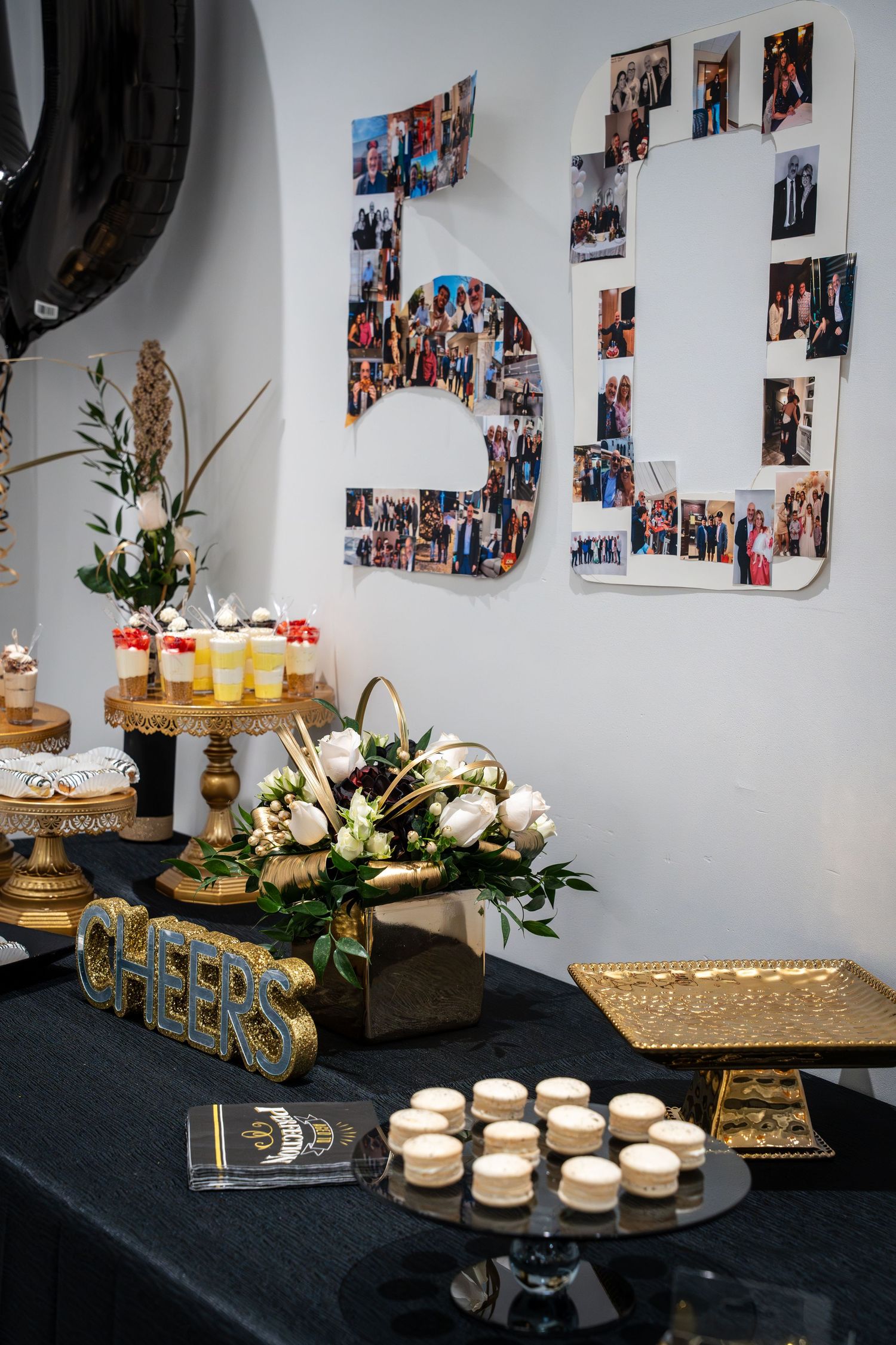 Elegant dessert display with gold accents and photo collage wall decoration.