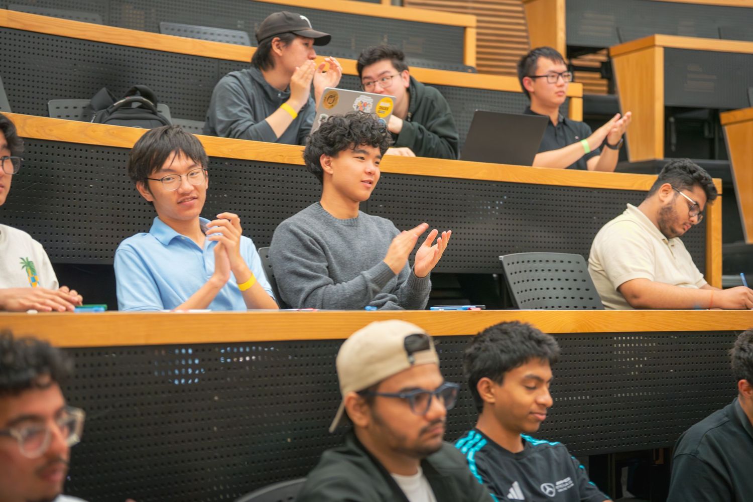 Students seated in tiered rows during a lecture or presentation.