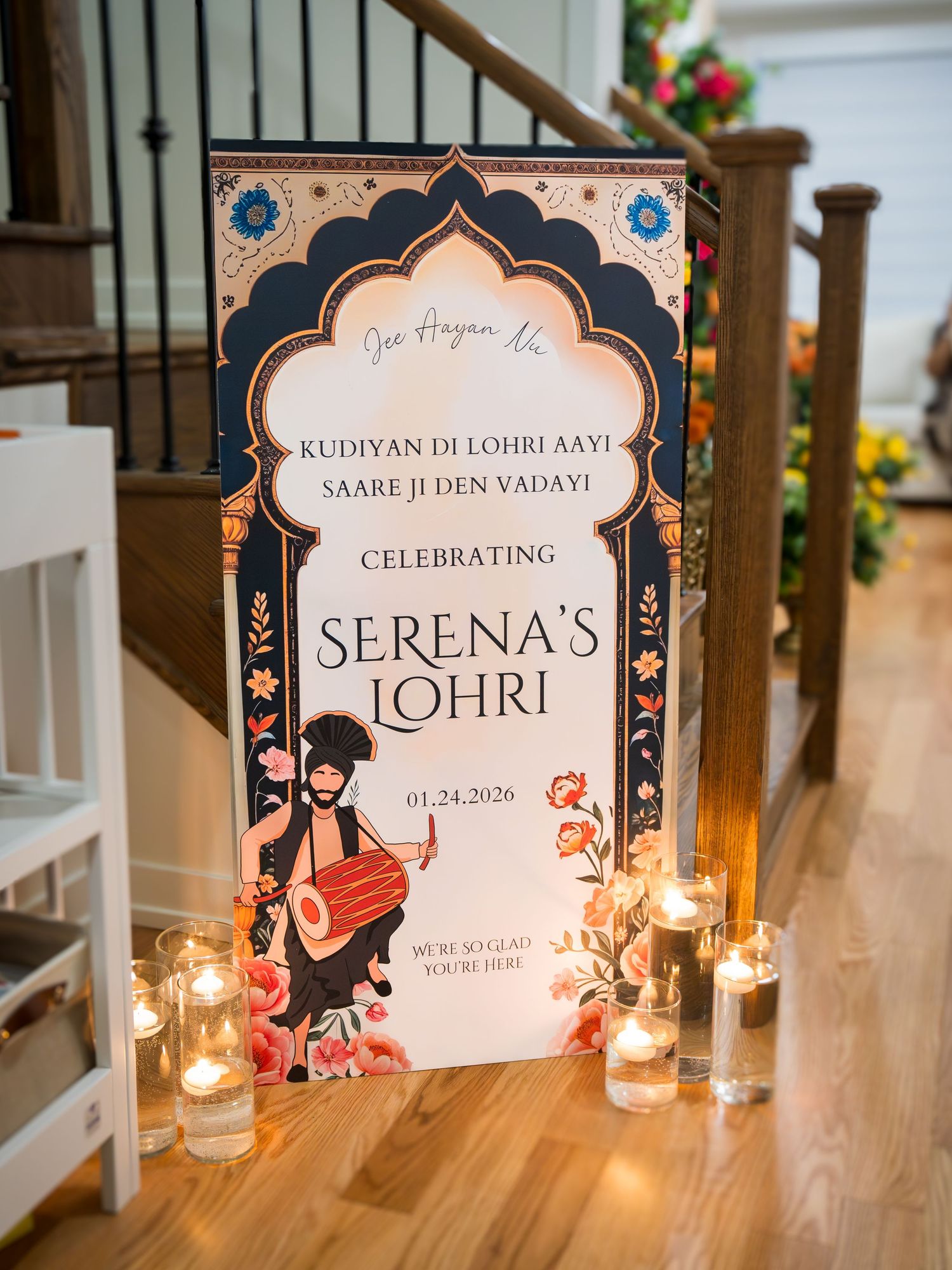 Decorative Lohri celebration welcome sign for Serena's Lohri on 01.24.2026 with candles and floral design.