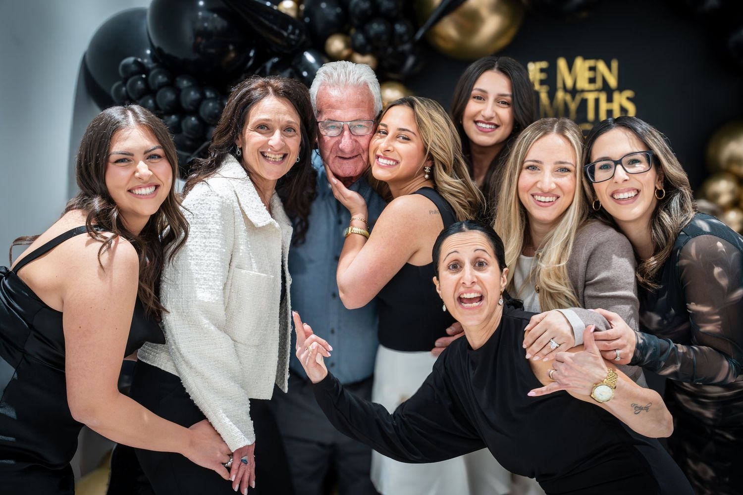 Group photos from formal celebration with gold balloon decorations.