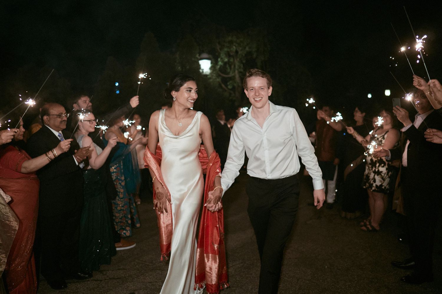 Nelstudios photographs a bride and groom at the Beach & Yacht Club in Mamaroneck NY, in Westchester, as they are lit by sparklers.