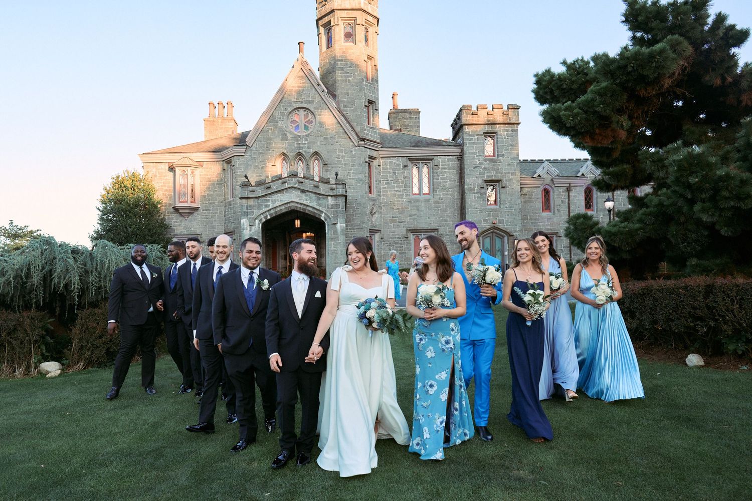 Nelstudios captures an editorial magazine moment of the bride and groom with their wedding party at Whitby Castle, Rye, Westchester, NY.