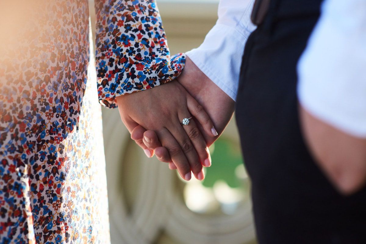 Nelstudios photographs an engagement shoot for a couple in Westchester, NY where they hold hands candidly.