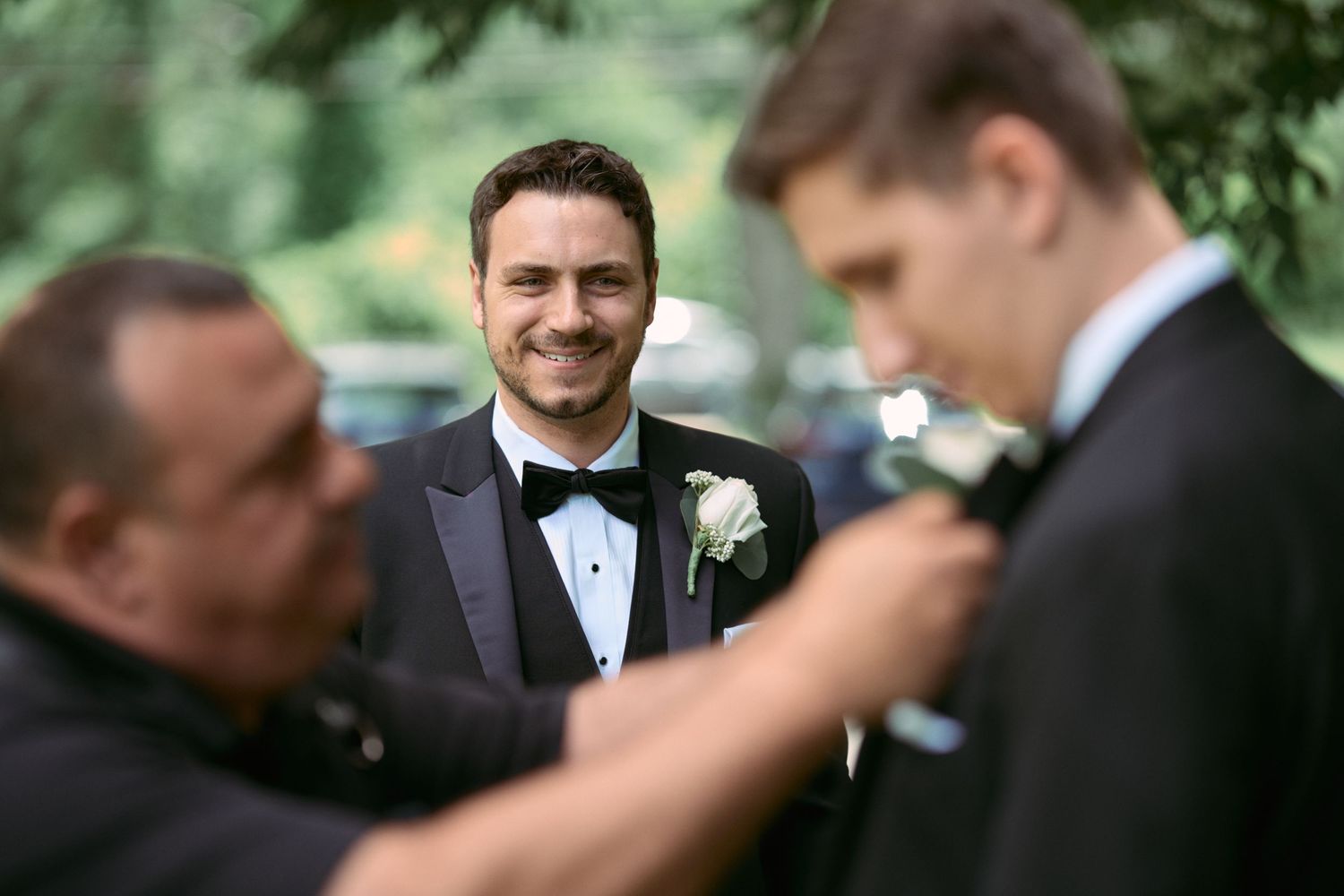 Nelstudios photographs a natural and authentic moment of the groom smiling during his wedding in Westchester, NY.
