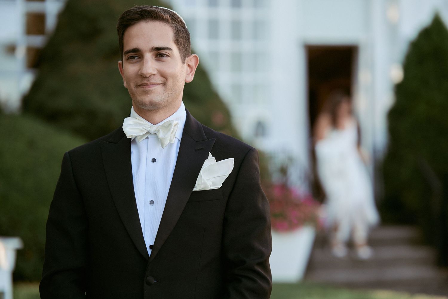 Nelstudios photographs a Jewish Wedding at The Inn at Longshore, CT, USA where the groom patiently waits for his bride for the first look.