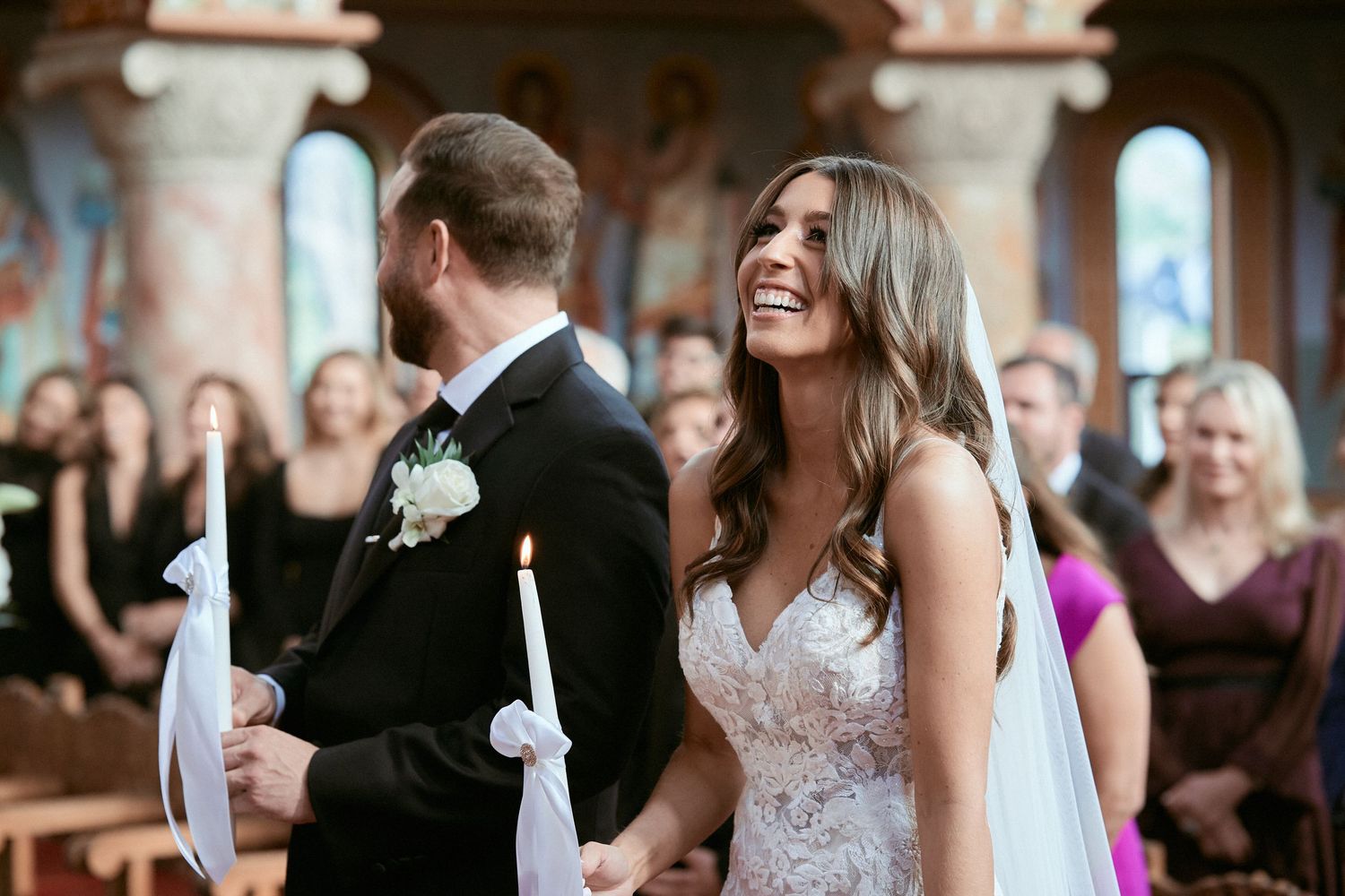 Nelstudios photographs a bride and groom in Westchester, NY, as they stand in front of the church together during their wedding ceremony.