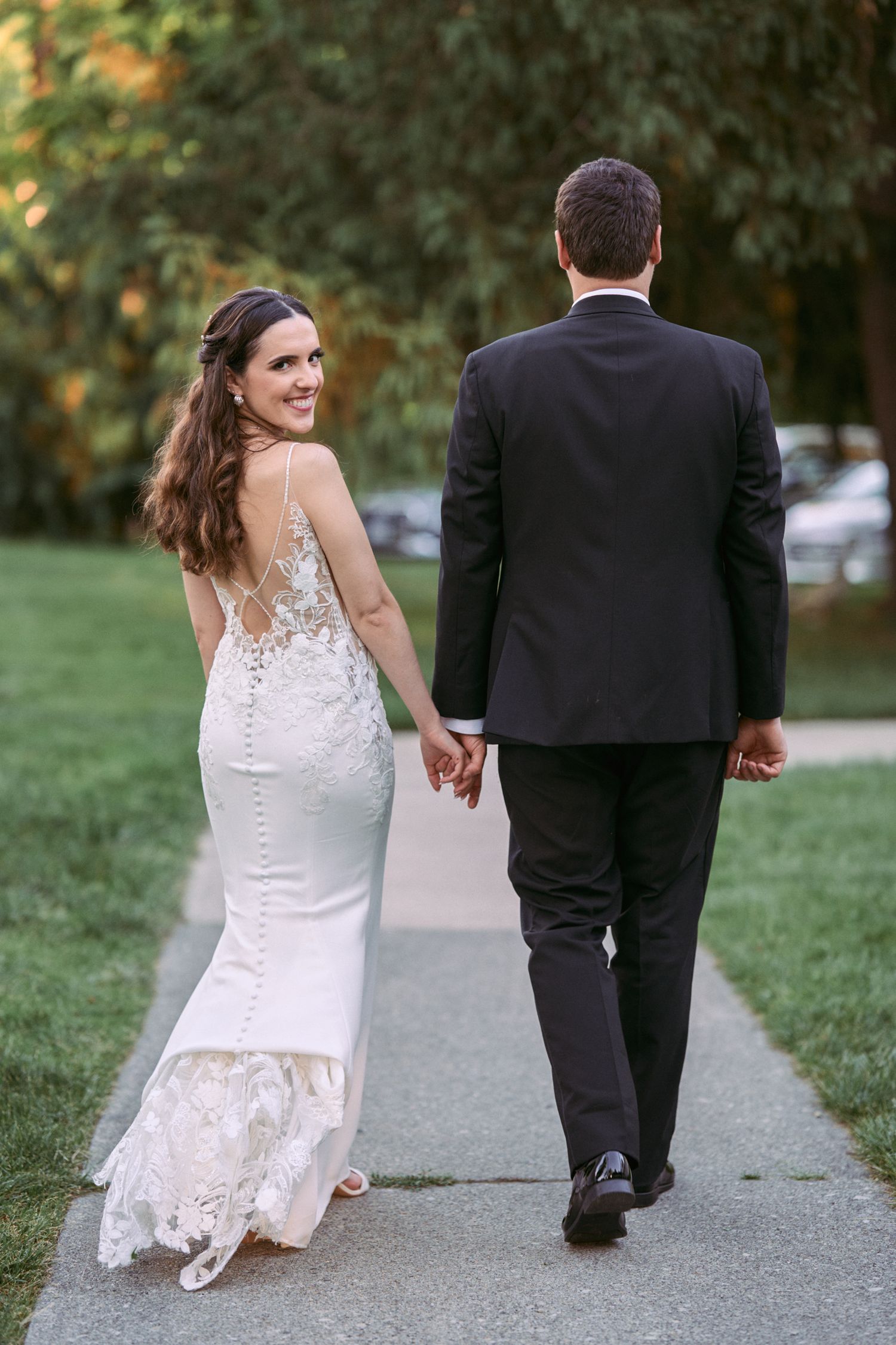 Nelstudios photographs a candid moment of a bride looking back at the camera in Hudson-Valley, NY.